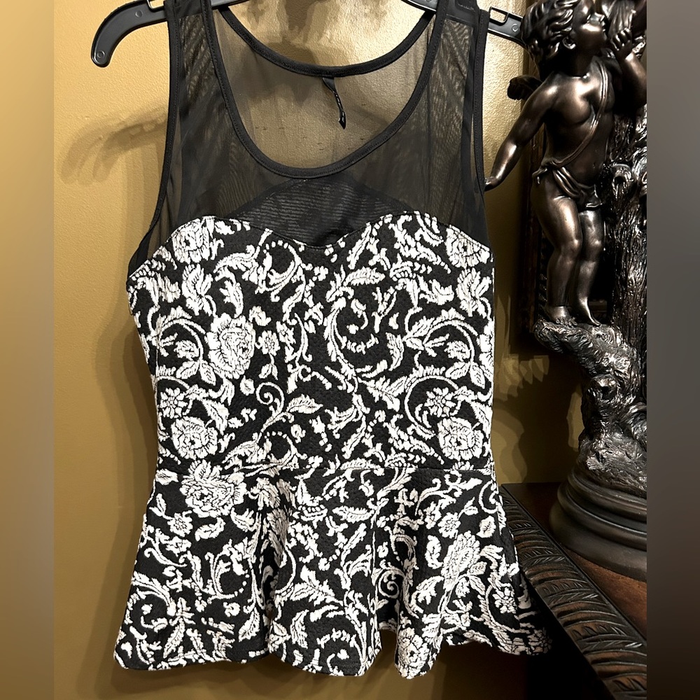 - B. Jewel Color Blocked Peplum Top